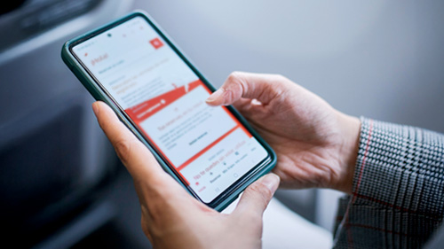  Person checking flight auctions on the Iberia website on their phone