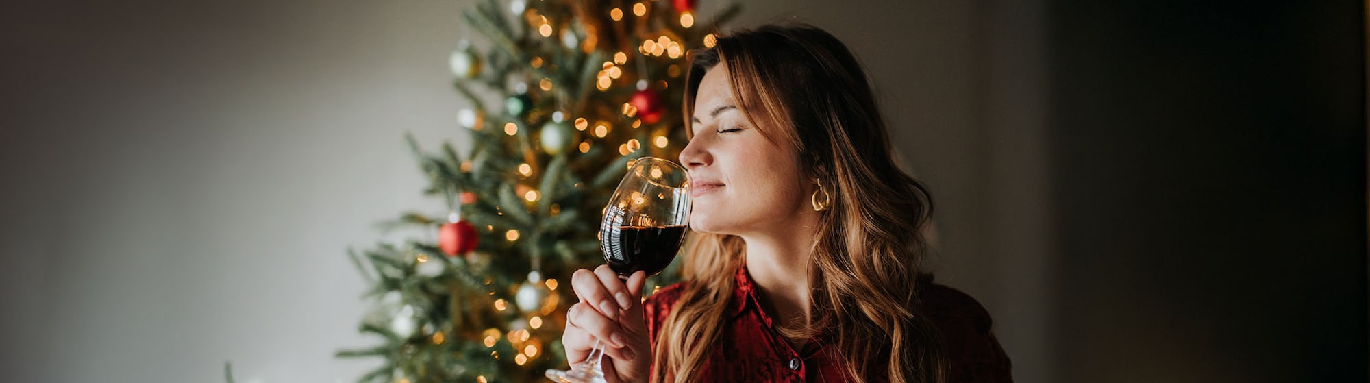 The image shows a couple drinking wine.